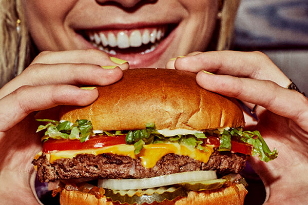 Enjoying a Gourmet Cheeseburger